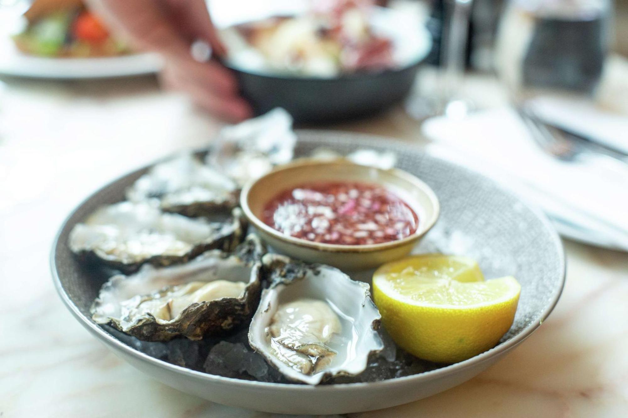 Hilton Rotterdam Hotel Exterior photo Oysters with a vinegar sauce